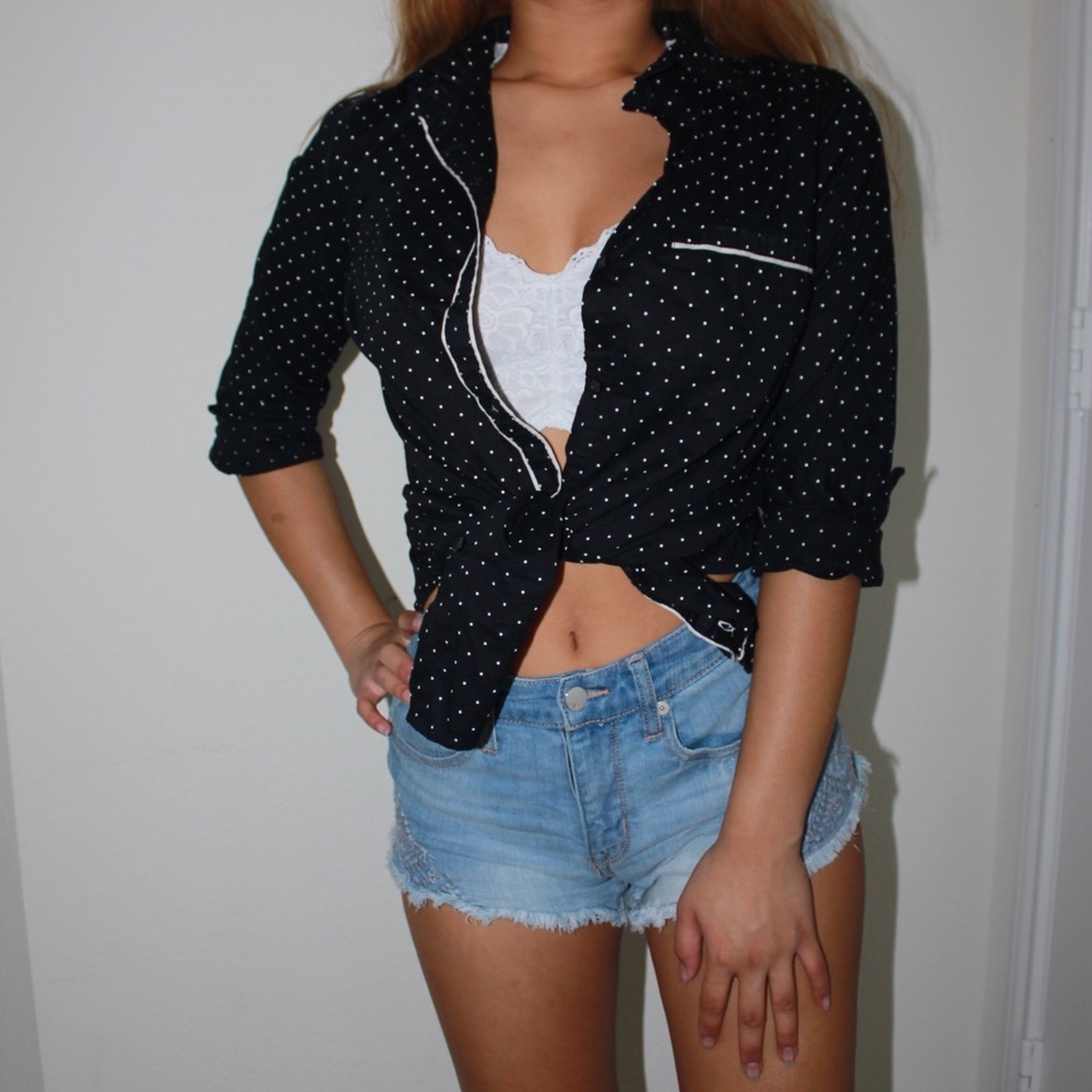 black and white polka-dotted top with trimming